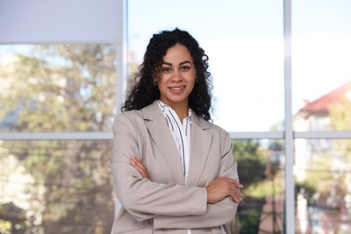 Photo of Portrait of young woman wearing stylish suit indoors