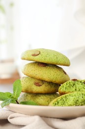 Photo of Delicious mint chocolate chip cookies on table, closeup