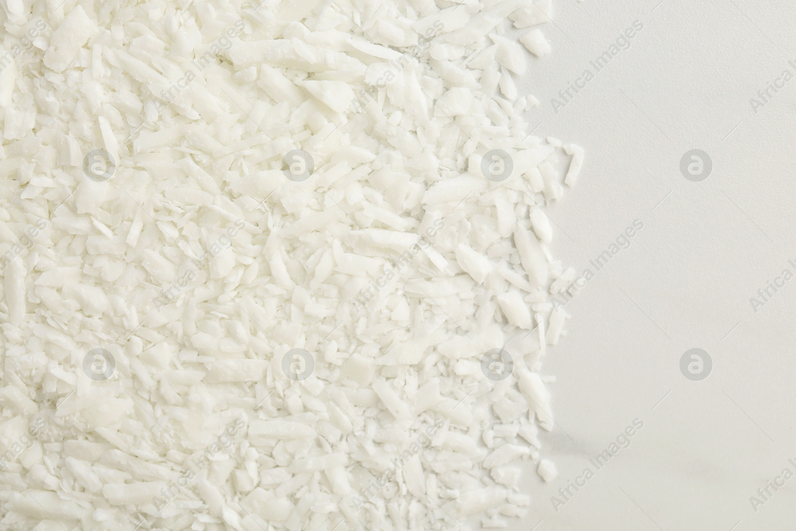 Photo of Soy wax on white marble table, top view