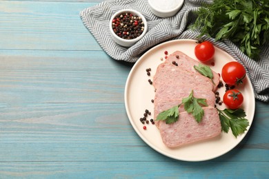 Photo of Pieces of tasty canned meat, parsley, peppercorns and tomatoes on light blue wooden table, flat lay. Space for text