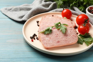 Pieces of tasty canned meat, parsley, peppercorns and tomatoes on light blue wooden table, closeup