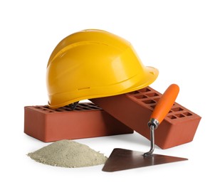 Photo of Construction materials, hardhat and bucket trowel isolated on white