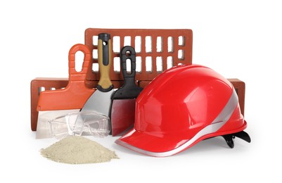 Photo of Building materials, safety equipment and construction tools isolated on white