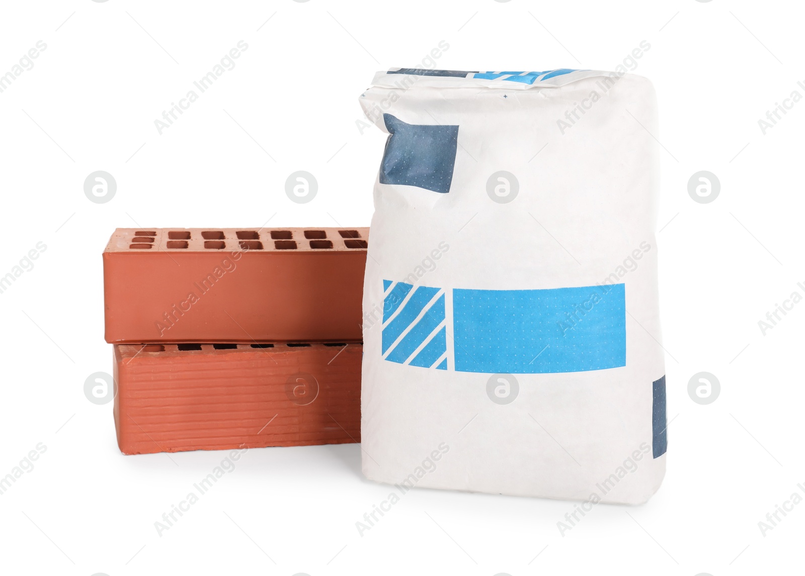 Photo of Red bricks and bag of cement isolated on white. Construction material