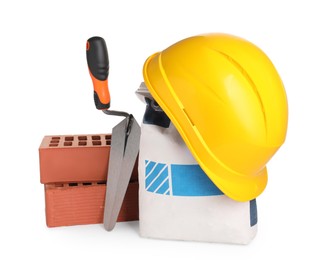 Photo of Construction materials, hardhat and bucket trowel isolated on white