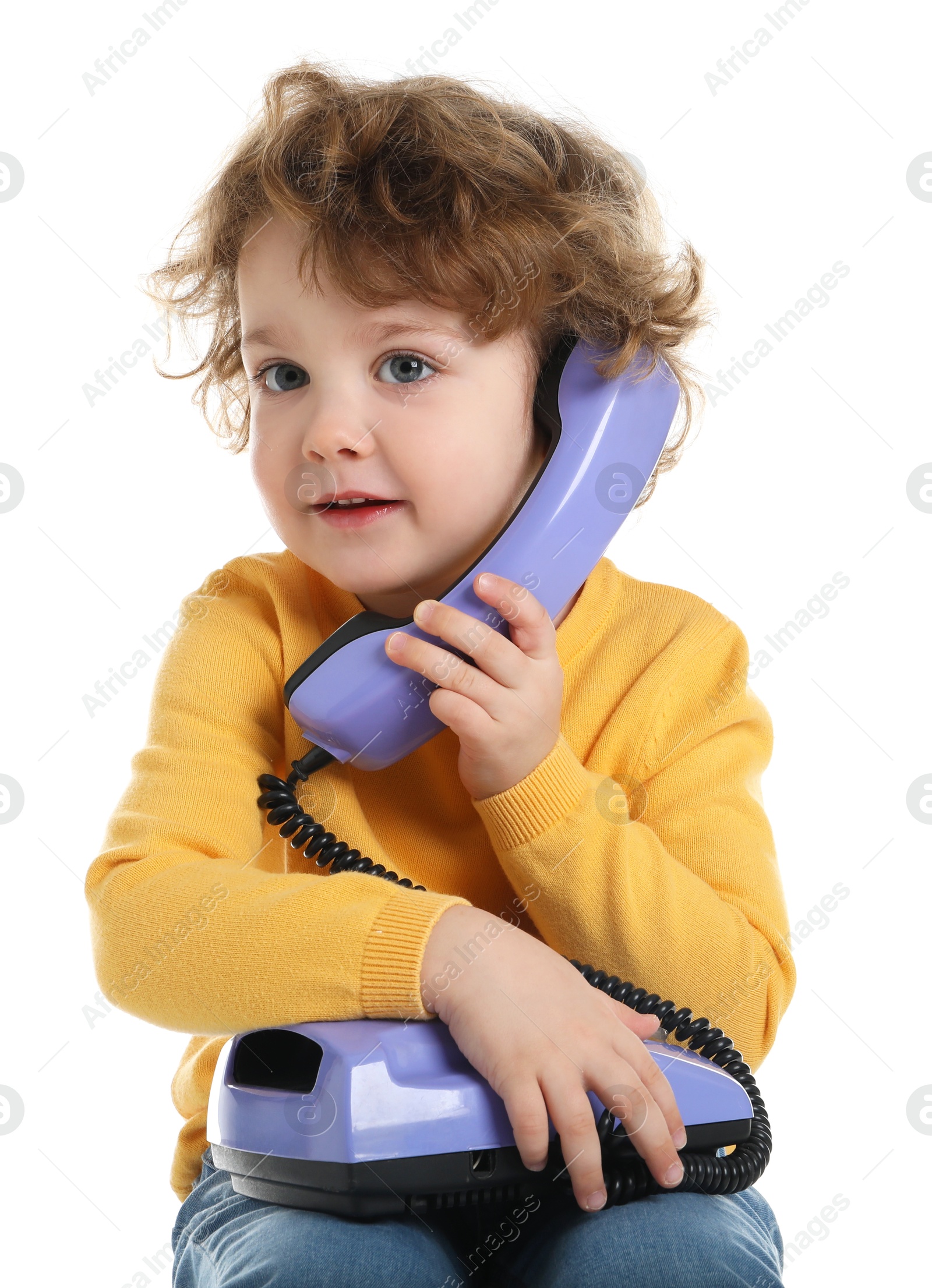 Photo of Cute little boy with telephone on white background