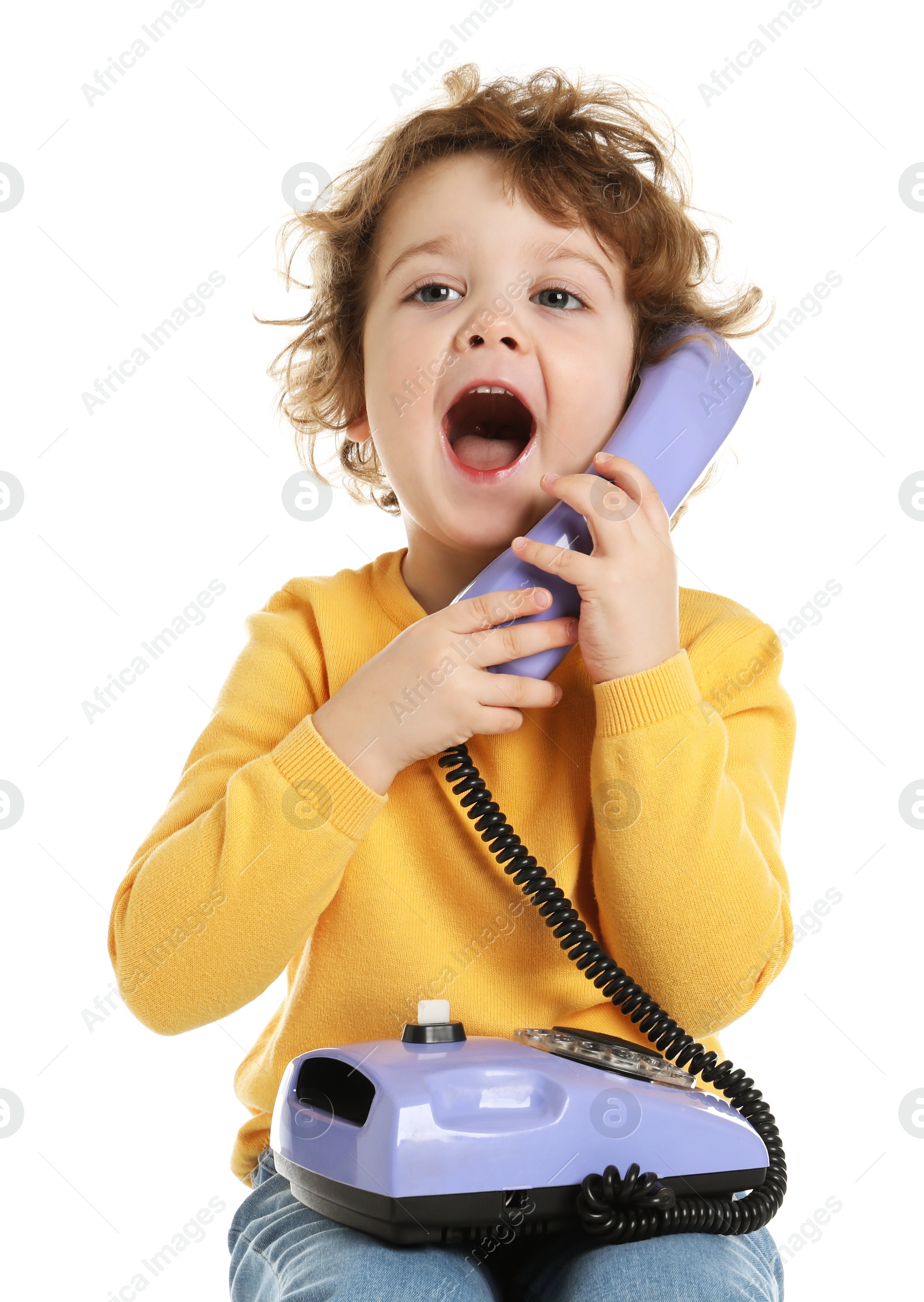 Photo of Cute little boy with telephone on white background