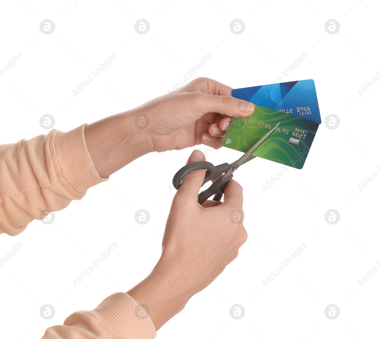 Photo of Woman cutting credit cards on white background, closeup