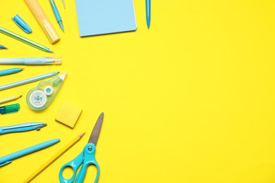 Photo of Different stationery on yellow background, flat lay. Space for text