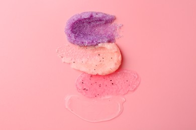 Photo of Samples of cosmetic products on pink background, top view. Skin care