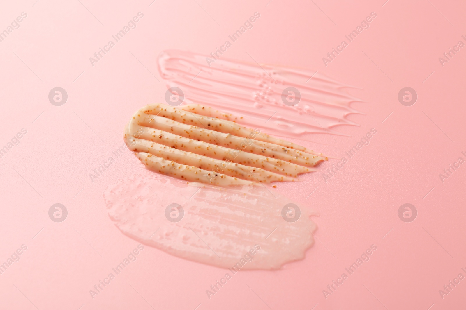 Photo of Samples of cosmetic products on pink background. Skin care