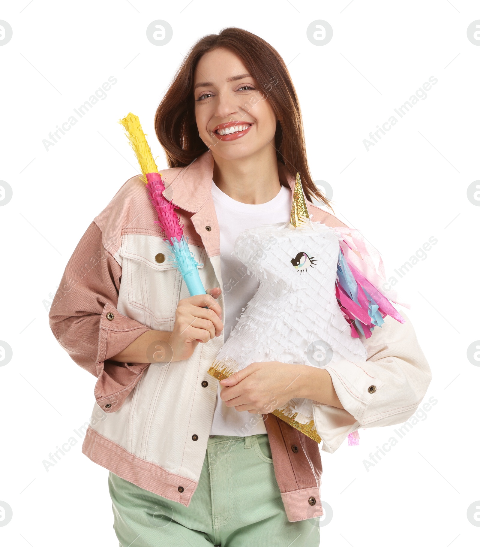 Photo of Happy woman with unicorn shaped pinata and stick isolated on white