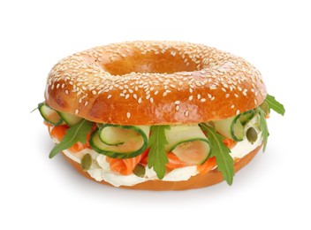 Photo of Delicious bagel with salmon, cream cheese and cucumber isolated on white