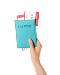 Photo of Woman holding passport with tickets on white background, closeup