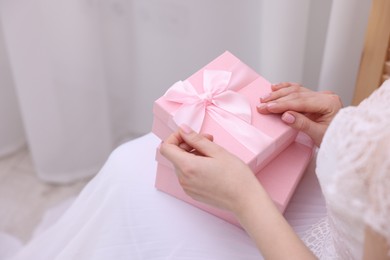 Photo of Bride with beautiful wedding gifts indoors, closeup. Space for text