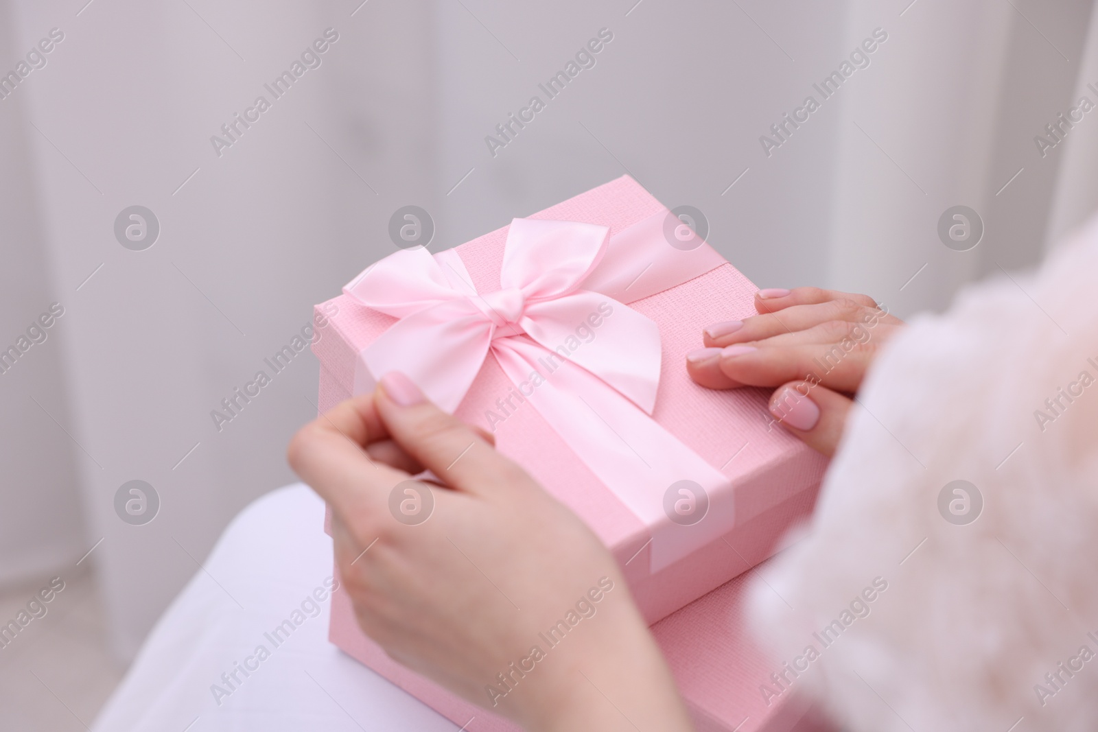 Photo of Bride with beautiful wedding gifts indoors, closeup. Space for text