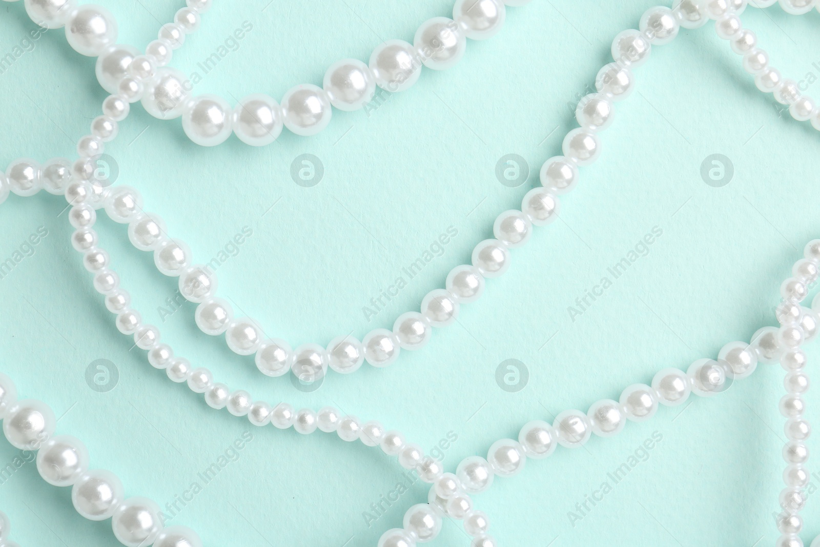 Photo of Stylish accessories on light blue background, flat lay