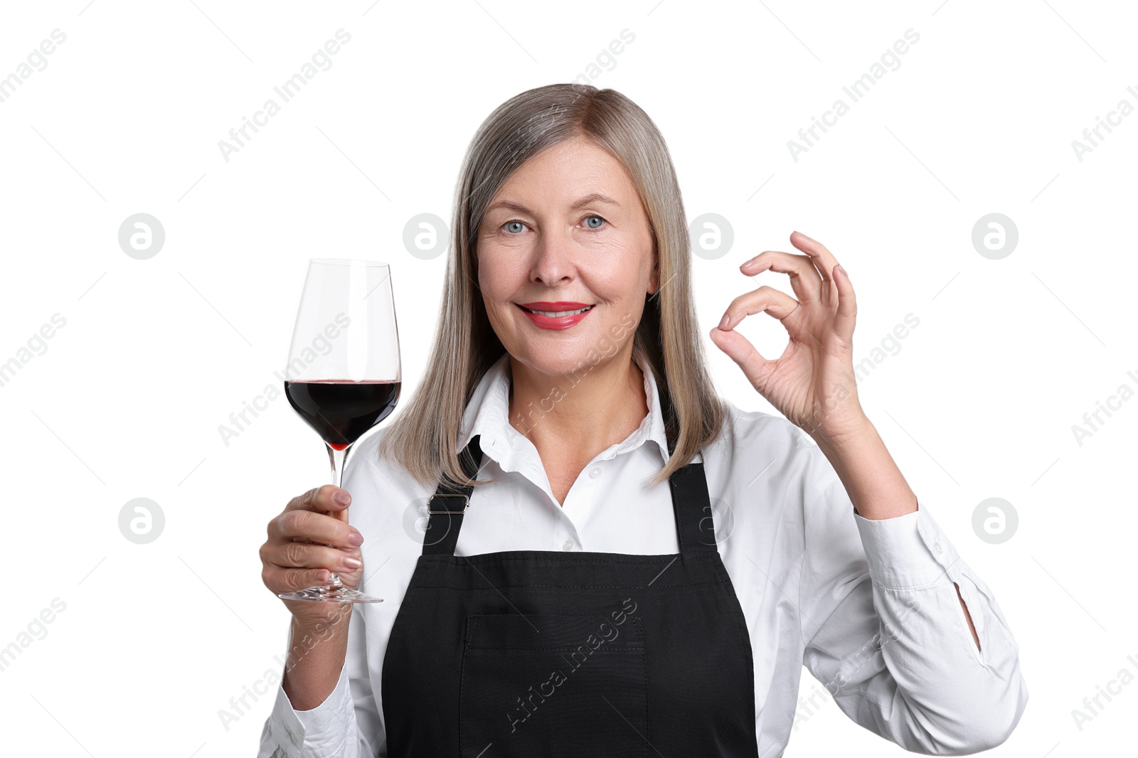 Photo of Senior woman with glass of wine showing okay gesture on white background