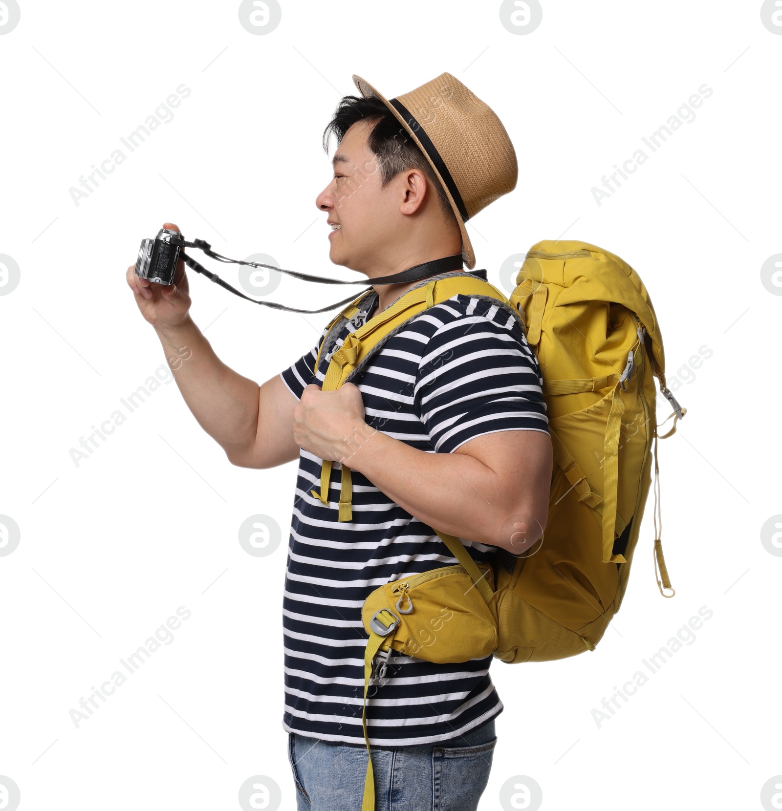 Photo of Traveller with backpack taking photo on white background