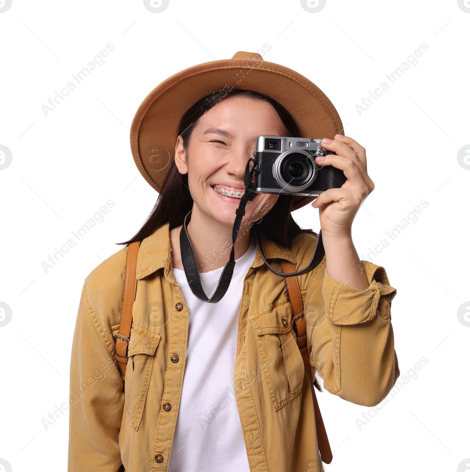 Photo of Happy traveller taking photo on white background