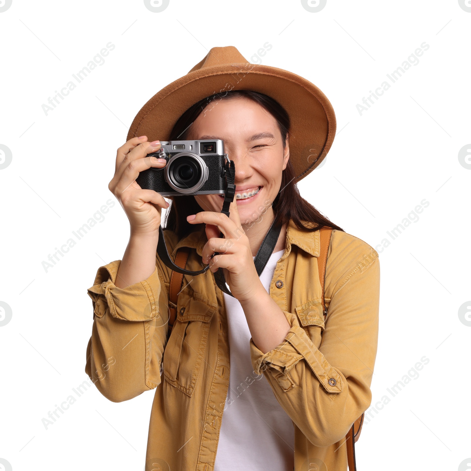 Photo of Happy traveller taking photo on white background