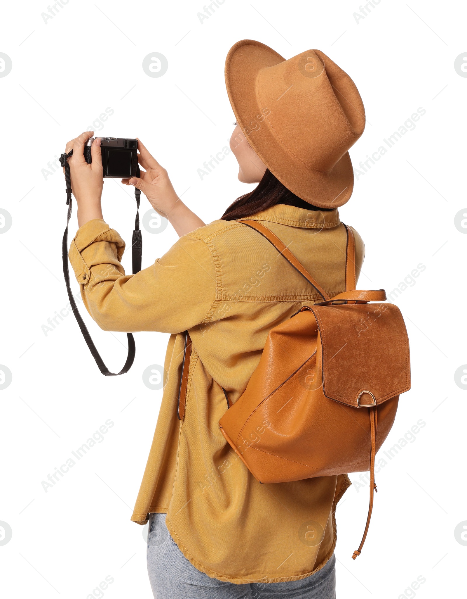 Photo of Traveller with backpack taking photo on white background, back view