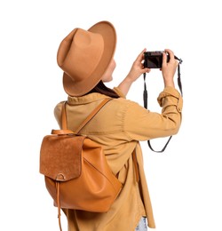 Photo of Traveller with backpack taking photo on white background, back view