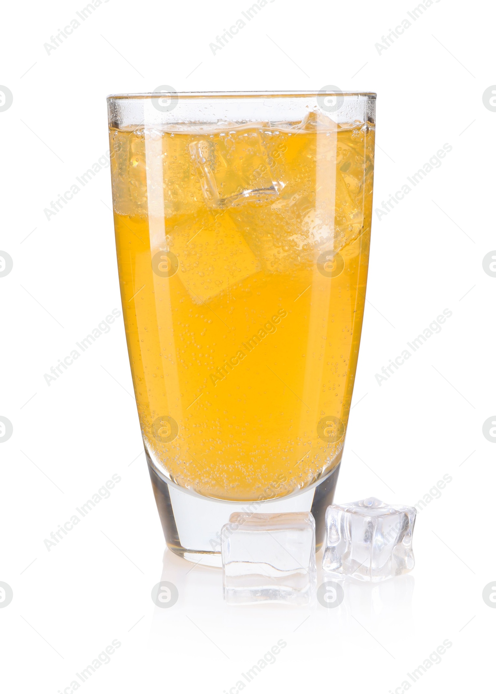 Photo of Sweet soda water in glass and ice cubes isolated on white