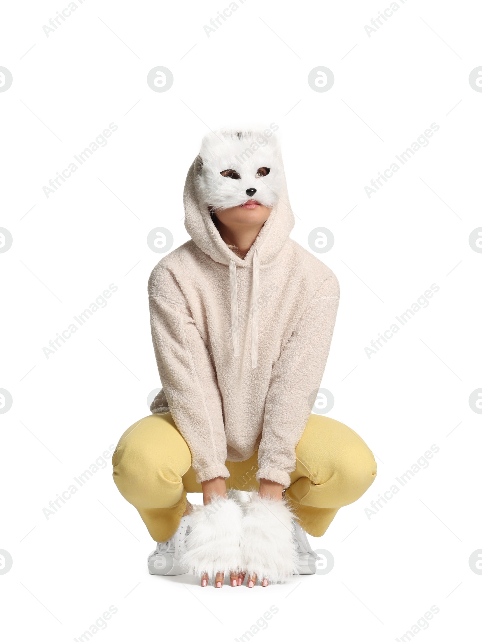 Photo of Quadrobics. Woman wearing cat mask and gloves on white background