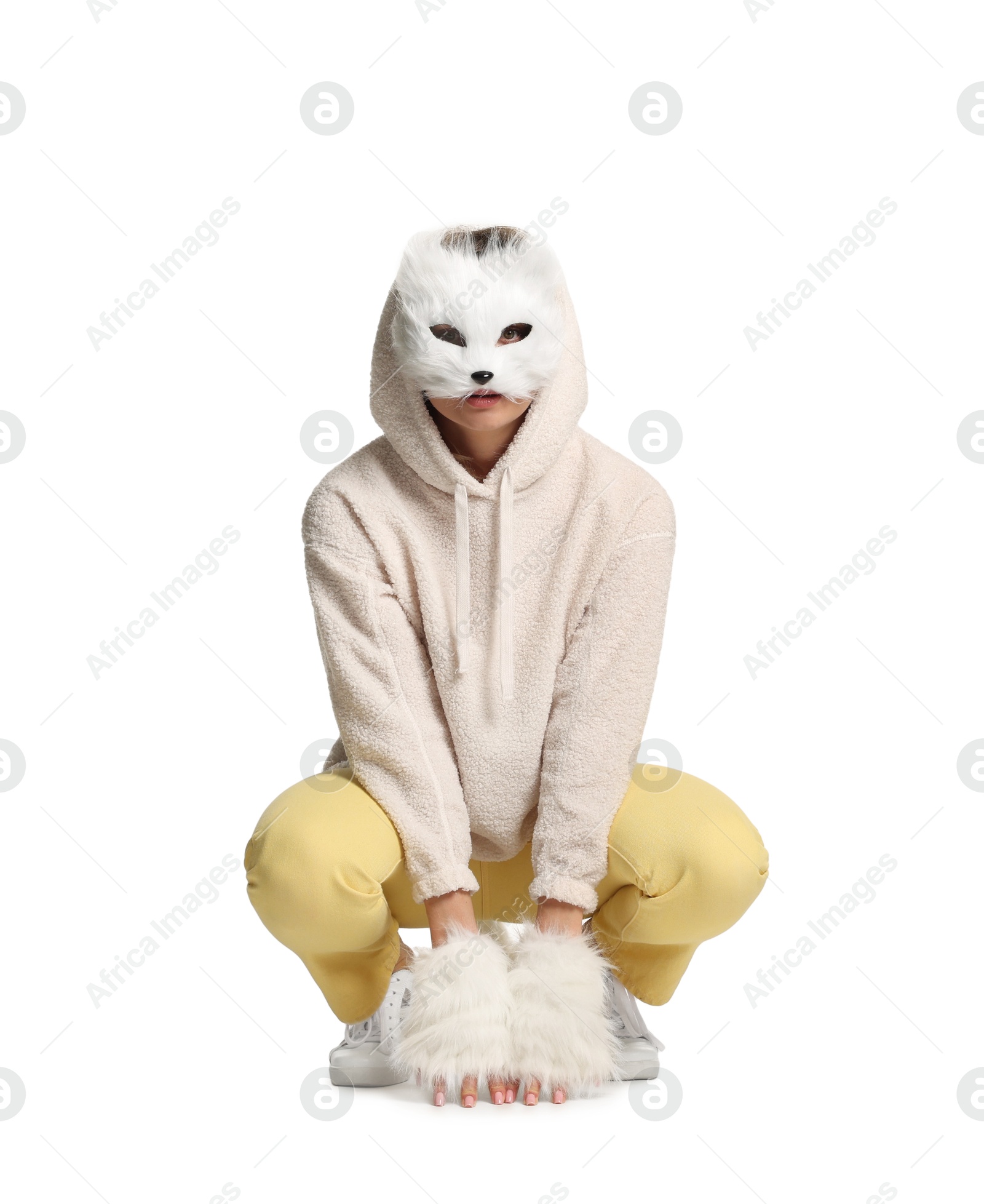 Photo of Quadrobics. Woman wearing cat mask and gloves on white background