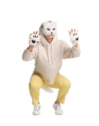 Photo of Quadrobics. Woman wearing cat mask, gloves and tail on white background