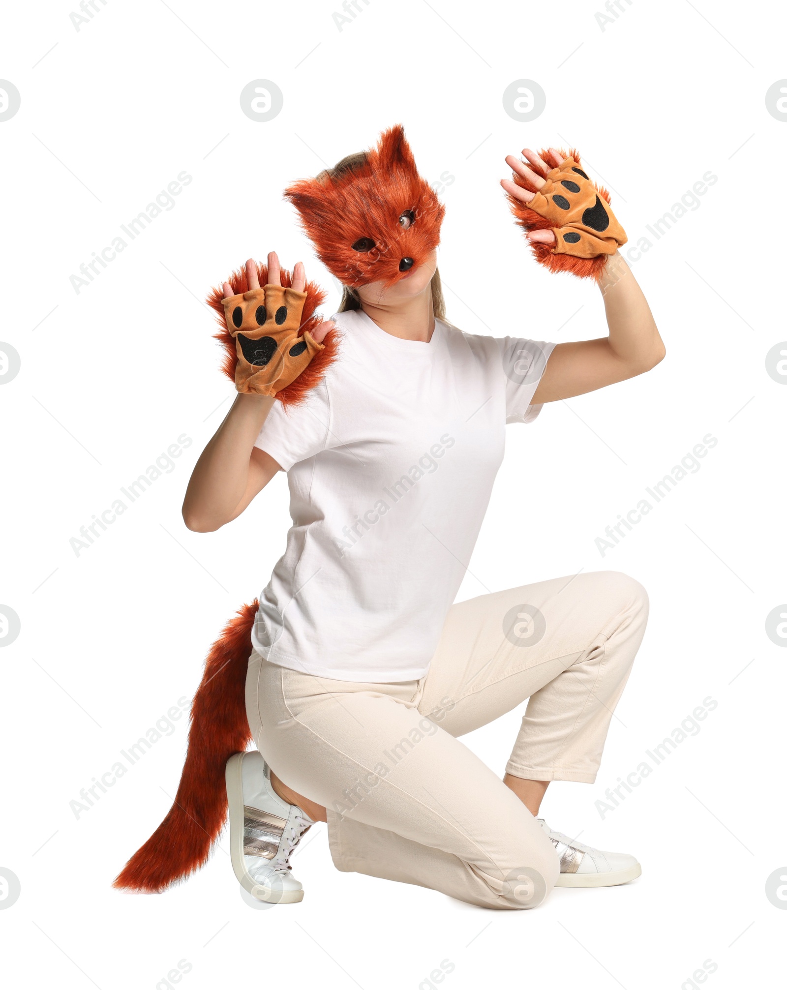 Photo of Quadrobics. Woman wearing fox mask, gloves and tail on white background