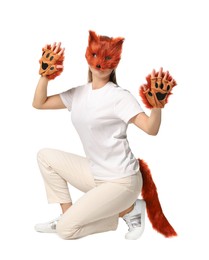 Photo of Quadrobics. Woman wearing fox mask, gloves and tail on white background