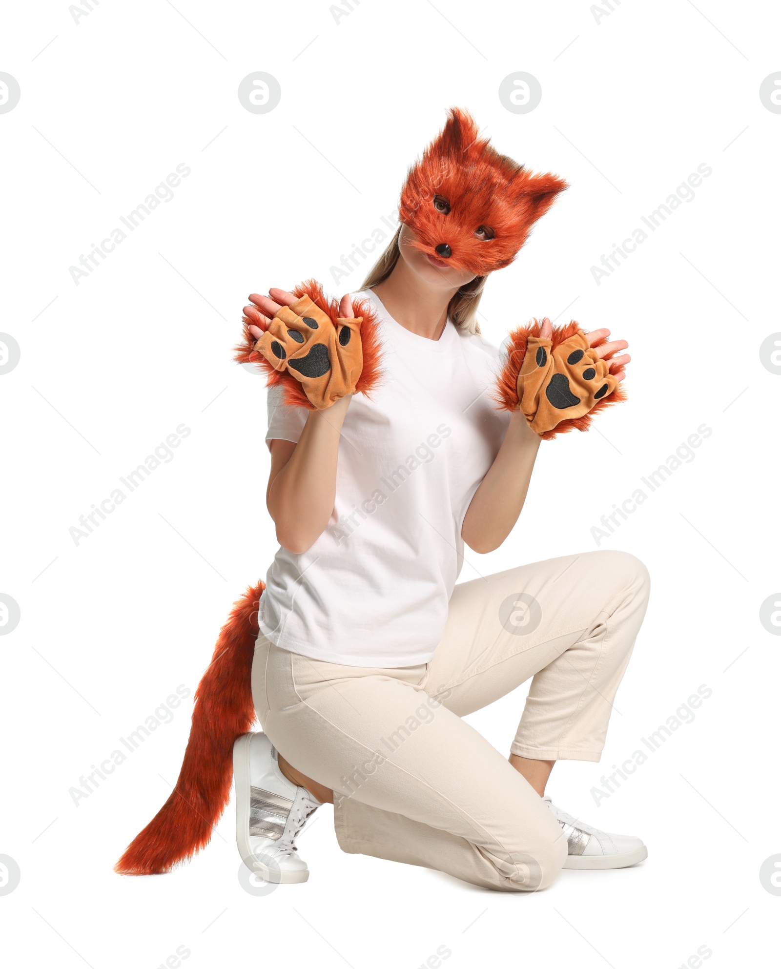 Photo of Quadrobics. Woman wearing fox mask, gloves and tail on white background