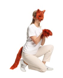 Photo of Quadrobics. Woman wearing fox mask, gloves and tail on white background