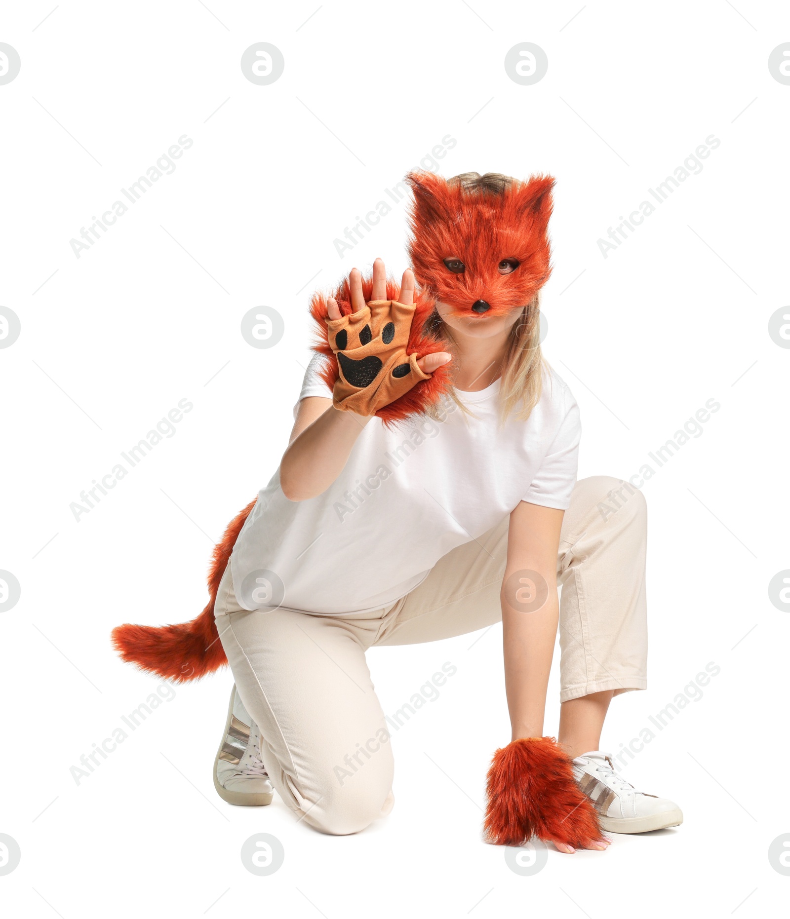 Photo of Quadrobics. Woman wearing fox mask, gloves and tail on white background