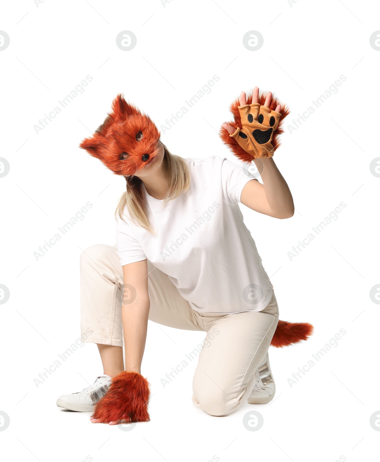 Photo of Quadrobics. Woman wearing fox mask, gloves and tail on white background