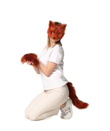 Photo of Quadrobics. Woman wearing fox mask, gloves and tail on white background