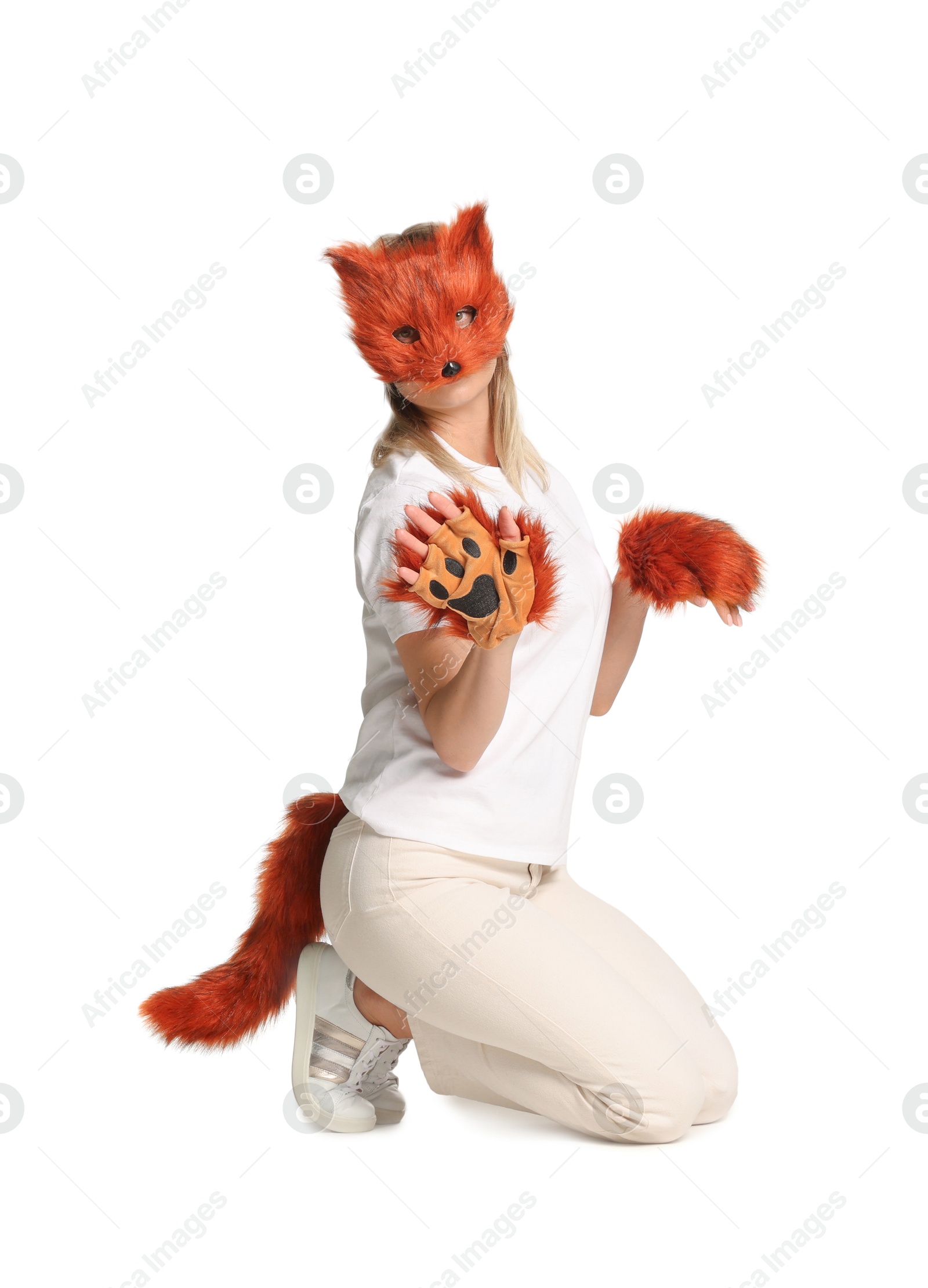 Photo of Quadrobics. Woman wearing fox mask, gloves and tail on white background