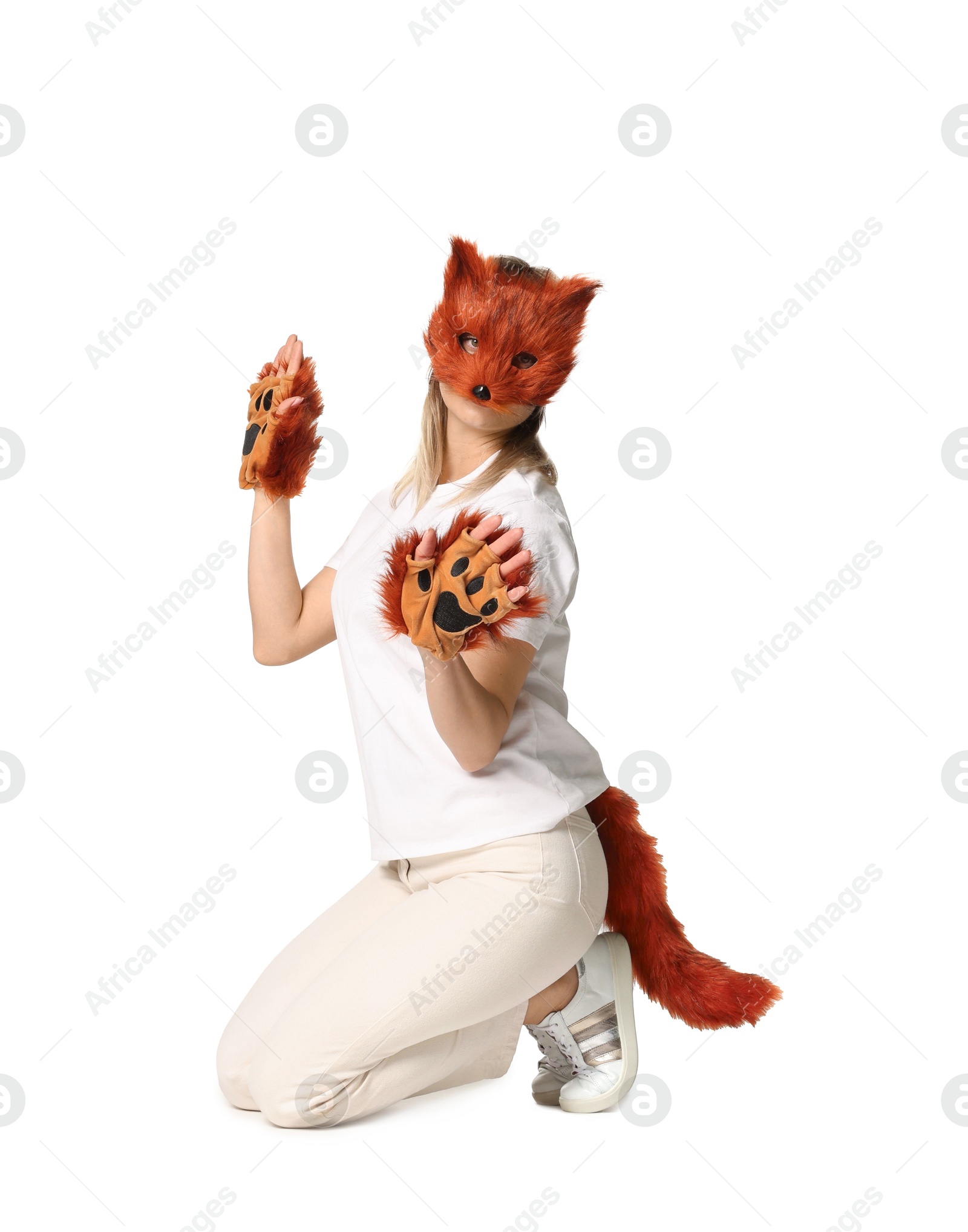 Photo of Quadrobics. Woman wearing fox mask, gloves and tail on white background