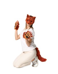 Photo of Quadrobics. Woman wearing fox mask, gloves and tail on white background