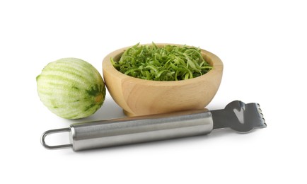 Photo of Lime zest, fresh fruit and zester tool isolated on white