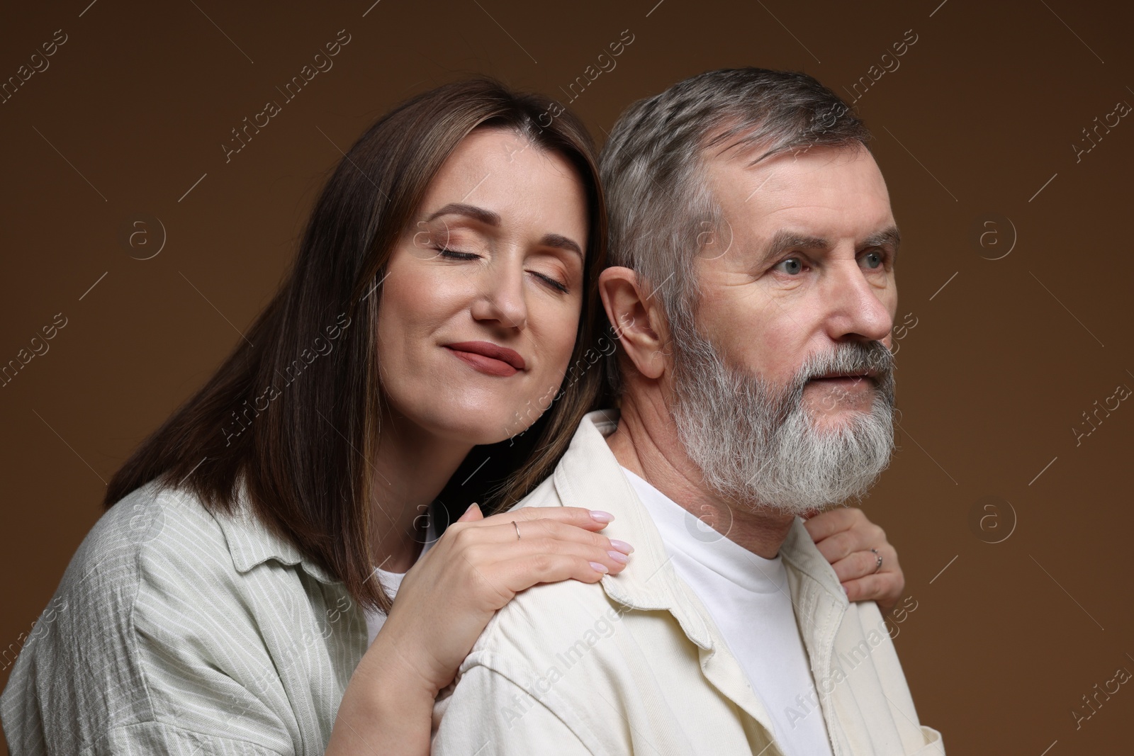 Photo of Daughter and her father on brown background