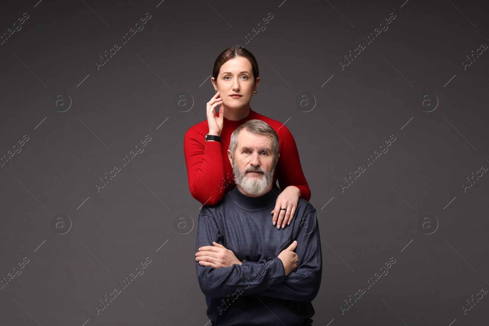 Photo of Family portrait of daughter and her father on dark background