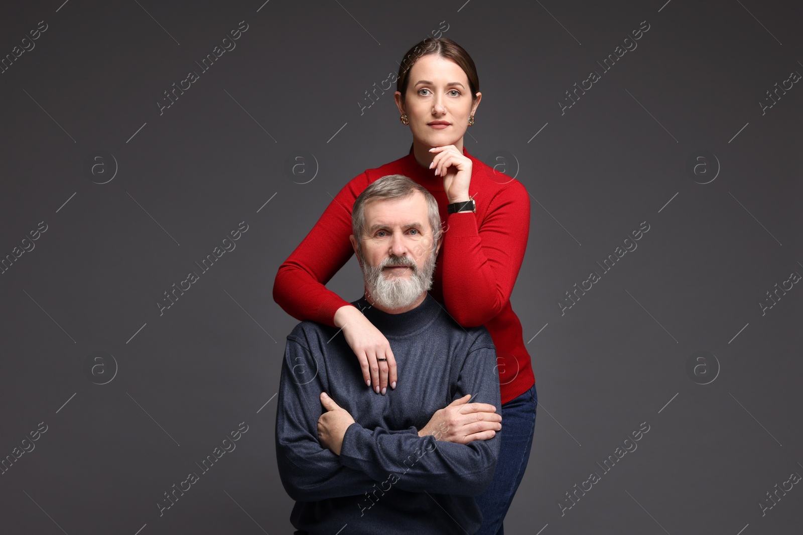 Photo of Family portrait of daughter and her father on dark background