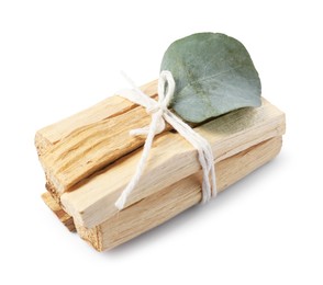 Photo of Palo santo sticks and eucalyptus leaf isolated on white