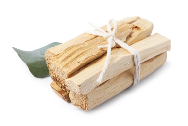 Photo of Palo santo sticks and eucalyptus leaf isolated on white