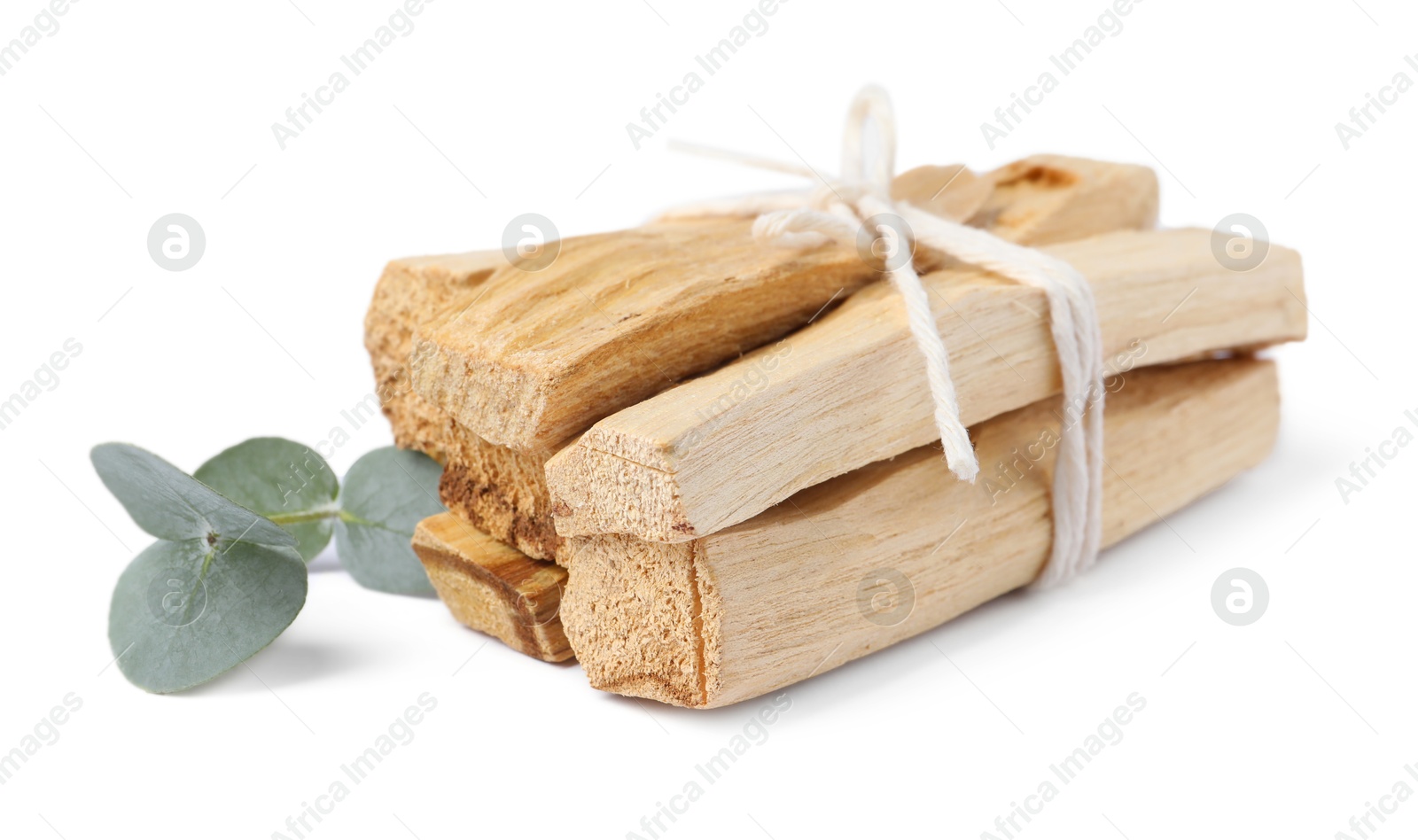 Photo of Palo santo sticks and eucalyptus branch isolated on white