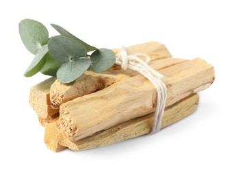 Photo of Palo santo sticks and eucalyptus branches isolated on white