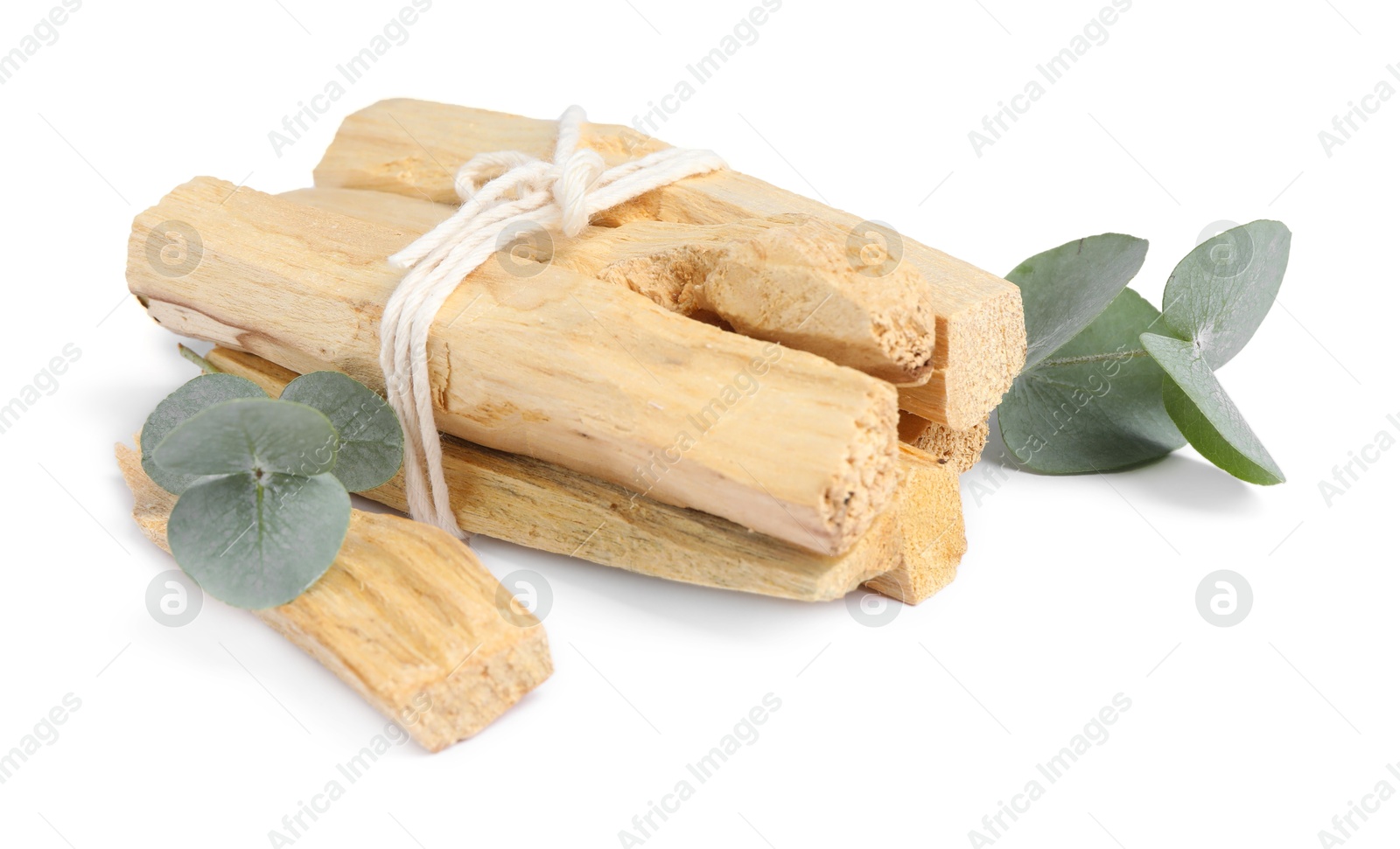 Photo of Palo santo sticks and eucalyptus branches isolated on white